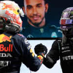 A silver Mercedes Formula 1 car leading under the lights at the Bahrain International Circuit ahead of a Red Bull Racing car during the 2026 season opener.