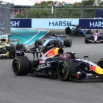 Formula 1 cars and engine graphics highlighting the new 2027 regulations featuring a revised 50-50 power balance system.