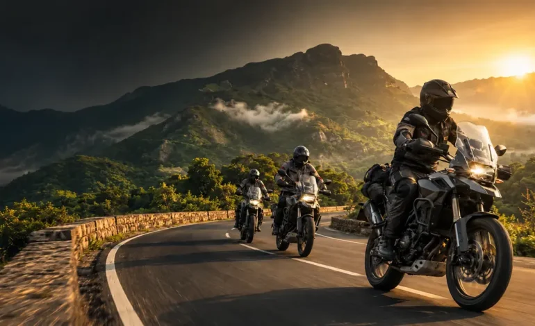 Three adventure bikes riders touring on a winding mountain road in India at sunrise.